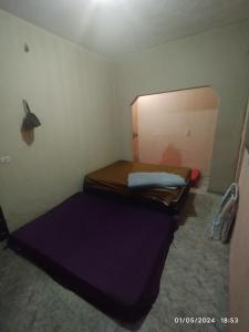En eller flere senge i et værelse på Hostel parque ecológico