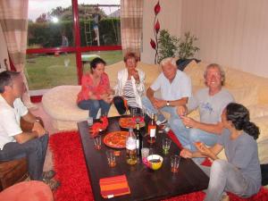 a group of people sitting in a living room at un amour de maison in Le Conquet