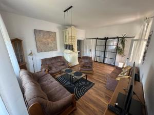 a living room with a couch and a table at Apartament ALMAR Cieplice-Zdrój in Jelenia Góra