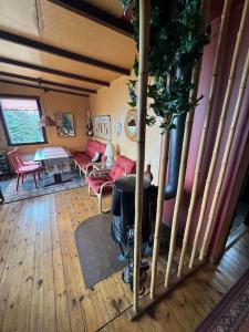 a living room with a couch and a fireplace at Lovely retro cabin close to Geysir and Gullfoss in Selfoss