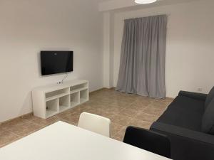 TV a/nebo společenská místnost v ubytování Casa Anita