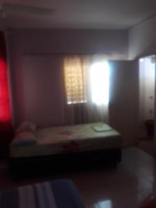 Ένα ή περισσότερα κρεβάτια σε δωμάτιο στο San Miguel Hostal