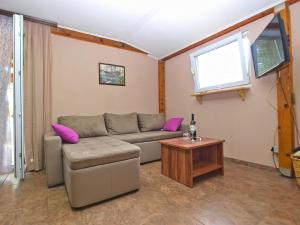 a living room with a couch and a table at Ferienhaus für 6 Personen ca 50 qm in Peroj, Istrien Istrische Riviera in Peroj +12 photos