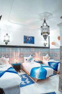 Postel nebo postele na pokoji v ubytování DAR CHEFCHAOUEN