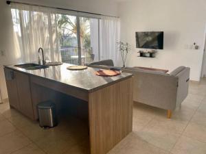 TV a/nebo společenská místnost v ubytování Charming and Cozy Condo San Blas