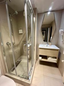 Koupelna v ubytování Hotel Martín Gusinde + 37 fotografií