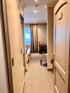 Rúm í herbergi á Hotel Martín Gusinde