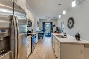 a kitchen with a stainless steel refrigerator at Spectacular Condo facing Riverwalk 1141 in San Antonio