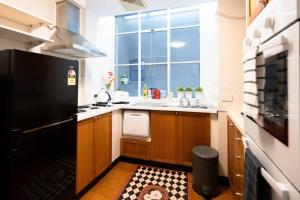 a kitchen with a sink and a large window at Vintage Charm in the Heart of Sydney CBD close to the Opera House in Sydney
