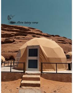 a large dome tent in the middle of a desert at Rum Mere luxury camp in Wadi Rum