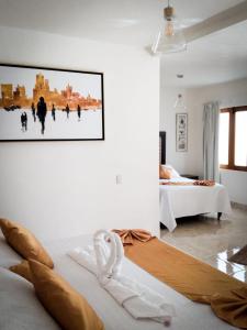 Ein Bett oder Betten in einem Zimmer der Unterkunft HOTEL BOUTIQUE MANSION LEONOR