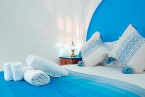 Ένα ή περισσότερα κρεβάτια σε δωμάτιο στο DAR CHEFCHAOUEN