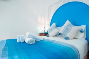 Ένα ή περισσότερα κρεβάτια σε δωμάτιο στο DAR CHEFCHAOUEN