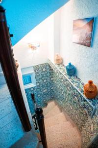 Ένα ή περισσότερα κρεβάτια σε δωμάτιο στο DAR CHEFCHAOUEN