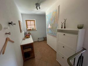 a kitchen with a white refrigerator and a counter at Ferienwohnung am Moosbach in Anger +22 photos