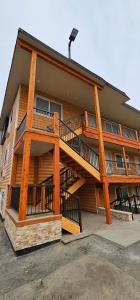 a large apartment building with a large deck at Eagle River Lodge in Eagle River