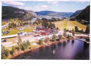 an aerial view of a town next to a lake at Reiårsfossen Hostel & Camping in Bygland