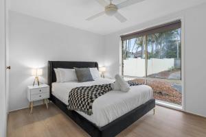 Tempat tidur dalam kamar di Amazing Water -Front Family Escape - Blue Bay