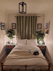 a bedroom with a large bed with two night stands at The cosy nook in Barnstaple