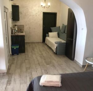 a bedroom with a bed and an archway in it at Elafonisi Villa above the Beach in Elafonisi