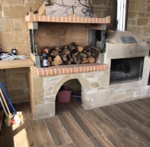 a brick fireplace with teddy bears in it at Elafonisi Villa above the Beach in Elafonisi