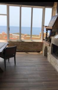 a living room with a view of the ocean at Elafonisi Villa above the Beach in Elafonisi