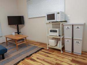 Kuchyň nebo kuchyňský kout v ubytování GLOCE 逗子葉山ハウス l 京急逗子葉山駅北口から徒歩1分 + 17 fotografií