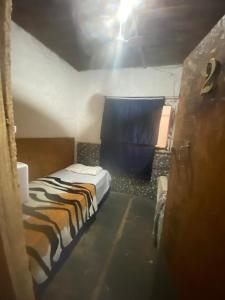 Giường trong phòng chung tại Quarto com Vista do Rio