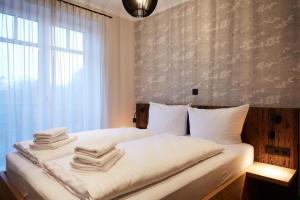 En eller flere senge i et værelse på Binnendiek Haus 1 Comfort-Apartment 5 + 23 billeder