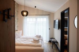 En eller flere senge i et værelse på Binnendiek Haus 1 Comfort-Apartment 10 + 20 billeder