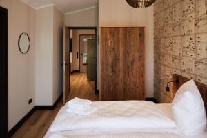 En eller flere senge i et værelse på Binnendiek Haus 2 Comfort-Apartment 10 + 23 billeder