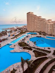 an aerial view of a resort with blue pools at Chalet in Porto Sokhna Beach Resort in Ain Sokhna
