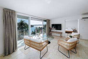 a living room with a view of the ocean at Mariner Apartments in Port Vila