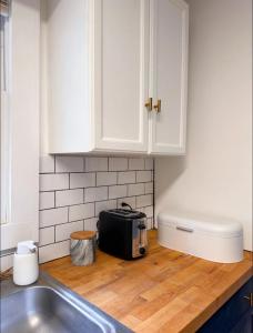 a kitchen with a sink and a toaster on a counter at Two bedroom house in Downtown Asheville in Asheville