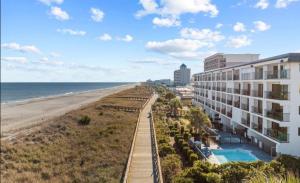 an aerial view of a hotel and the beach at Oceanfront * Pool * Elevator * Boardwalk in Carolina Beach