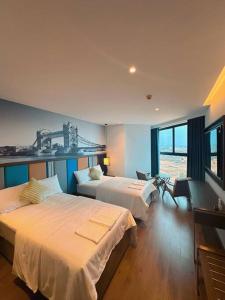 Posteľ alebo postele v izbe v ubytovaní Sea View Premier Apartment - Apec Mandala Mui Ne