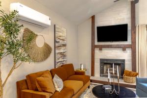a living room with a couch and a fireplace at Prime Location - 3bd with BBQ in McKinney