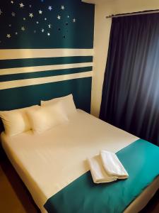 Postel nebo postele na pokoji v ubytování V Hotel Sri Gombak (Previously MyHome Hotel)