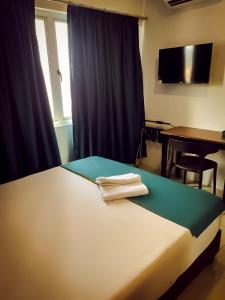 Postel nebo postele na pokoji v ubytování V Hotel Sri Gombak (Previously MyHome Hotel)
