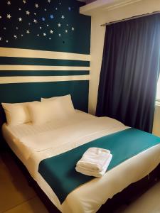 Postel nebo postele na pokoji v ubytování V Hotel Sri Gombak (Previously MyHome Hotel)