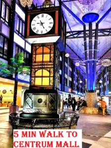 a clock tower in the middle of a shopping mall at HOTEL POP ASH in Brinchang