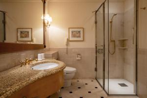 a bathroom with a toilet and a sink and a shower at Grand Nikko Tokyo Daiba in Tokyo