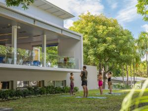 a group of people standing outside of a house at Explorar Koh Phangan - Adults Only Resort and Spa in Haad Rin