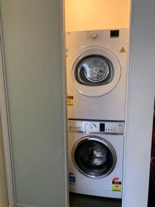 two washing machines are in a room at Great choice*3 Bedrooms in Fairfield