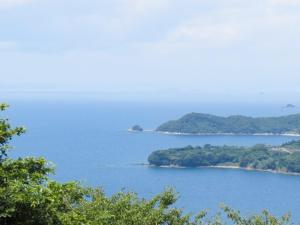 an island in the middle of a large body of water at エコホテル　湯の児荘 in Minamata