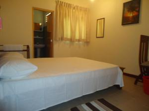 Postel nebo postele na pokoji v ubytování Guest House
