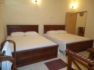 Postel nebo postele na pokoji v ubytování Guest House