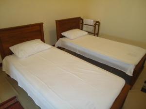 Postel nebo postele na pokoji v ubytování Guest House