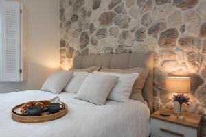 a bed with a basket of food on it at Bay View House in Corfu