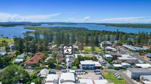 an aerial view of a small town next to a body of water at Sky Quay 8 in Yamba